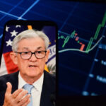 BOND SHOCK: 30-Year Yield Soars, Crisis Looms? Jerome Powell speaking on a smartphone screen with stock chart in background