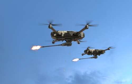 Armed,Drone,Firing,In,The,Sky,,Futuristic,Aerial,Attack,Drone. Two military drones firing projectiles in the sky