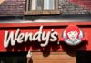 Wendy’s restaurant storefront sign with red-haired girl logo