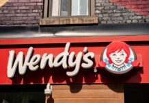 Wendy’s Giant Hits Court – Hundreds At Risk Wendy’s restaurant storefront sign with red-haired girl logo