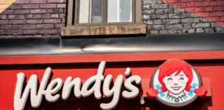 Wendy’s restaurant storefront sign with red-haired girl logo