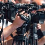 BUSTED: City Hall Cash Machine Exposed television cameras on tripods at a media event