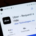 Smartphone screen showing Uber app listing in app store