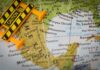 REPORT: Cartel Narco Fighters Hunt Drone Tactics A caution sign placed on a map highlighting Mexico and the Gulf of Mexico