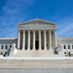 Supreme Court Shakes Women’s Sports U.S. Supreme Court building under clear blue sky.