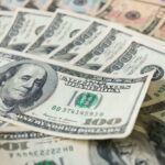 Trump Says $500 Checks Are On the Way Stacks of various U.S. dollar bills.