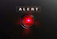 ALERT: Kratom Surfaces At Death Scenes Red alert light against black background, text ALERT.