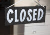 GOOD! Trump Admin Nukes 110 Of THESE Schools A black sign with the word 'CLOSED' painted in white letters