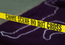WATCH: Family Massacre Shocks City Yellow crime scene tape marking off an area with a chalk outline