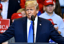 Trump Ally’s Flattery Triggers Backlash A man in a suit speaking at a rally.