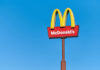 McDonald’s Villains Drop McDonald's restaurant sign against a clear blue sky