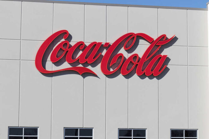Whitestown,-,Circa,March,2021:,Coca-cola,Plant.,Coca-cola,Manufactures,Coke, Red script logo on a white building facade