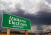 Early Surge Shocks Battlegrounds green roadside sign against a stormy sky