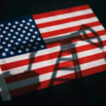 Trump Teases Drilling – Then Reality Hits American flag with oil pump shadow overlay.