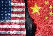 FBI Nabs China Spy A split image showing the American flag on one side and the Chinese flag on the other