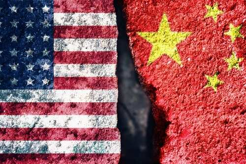 China,Vs,Us,Background,Concept,,Flags,Of,Usa,Or,United A split image showing the American flag on one side and the Chinese flag on the other