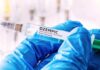 BOMBSHELL: Ozempic Kills Urge Gloved hands holding a syringe labeled Ozempic