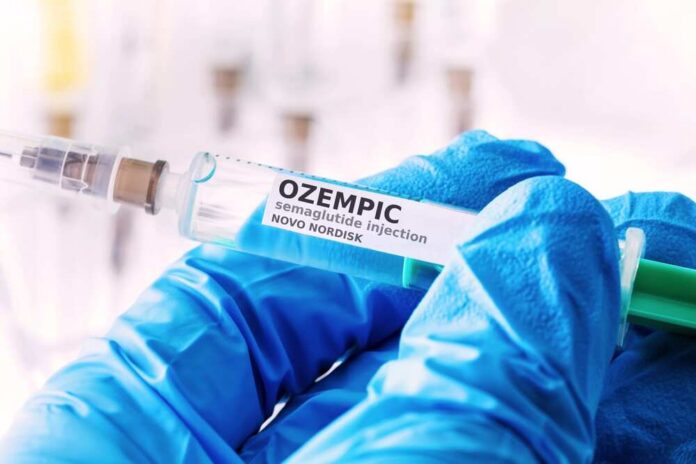 Gloved hands holding a syringe labeled Ozempic