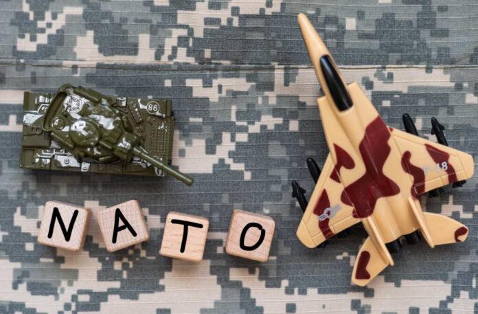 The,Word,'nato',Laid,The,Sleeves,On,The,Khaki,Background