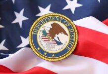 DOJ Drops Election Crime Bombs Department of Justice seal on an American flag background