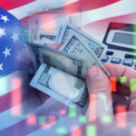 Stock Market Reaches Shocking Milestone USA flag calculator and hands holding dollars overlapping