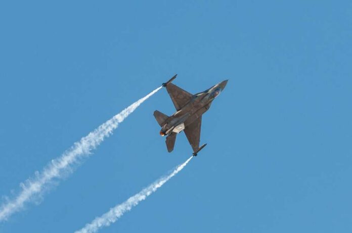 Athens,Greece,,September,21,2019:,Hellenic,F-16,Demo,Air,Fighter Fighter jet banking in flight with vapor trails