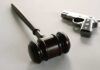 Bodycams vs Bullets: Feds On Trial wooden judge's gavel with a handgun in the background